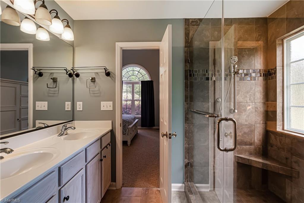 7611 Strawberry Road Summerfield, NC 27358 - Photo 12 of 22 Master Bath features a large tile shower and dual sinks!