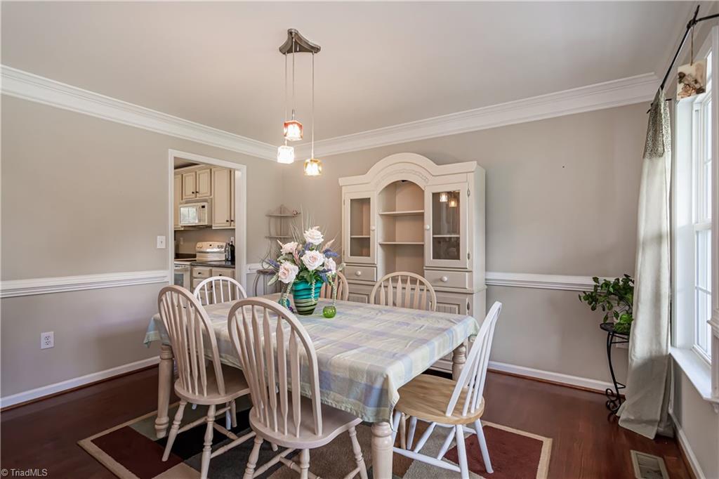 7611 Strawberry Road Summerfield, NC 27358 - Photo 3 of 22 Spacious dining room with custom lighting!