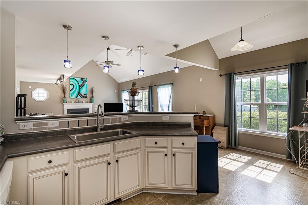 7611 Strawberry Road Summerfield, NC 27358 - Photo 5 of 22 Through the dining room, you come to the kitchen which is open to the large living room!