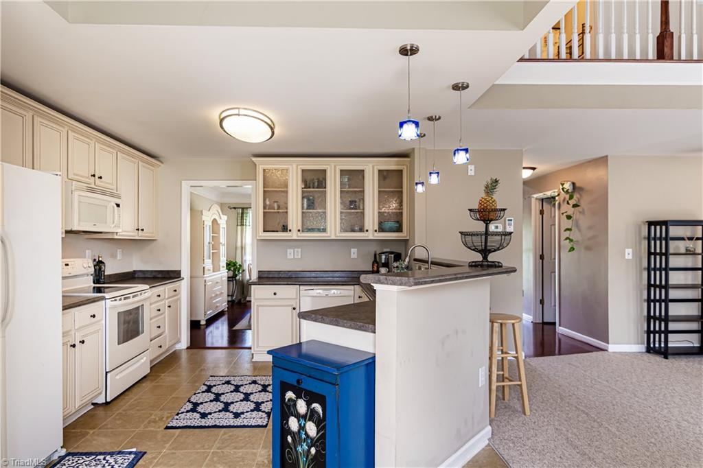 7611 Strawberry Road Summerfield, NC 27358 - Photo 6 of 22 The kitchen has plenty of counterspace and storage!