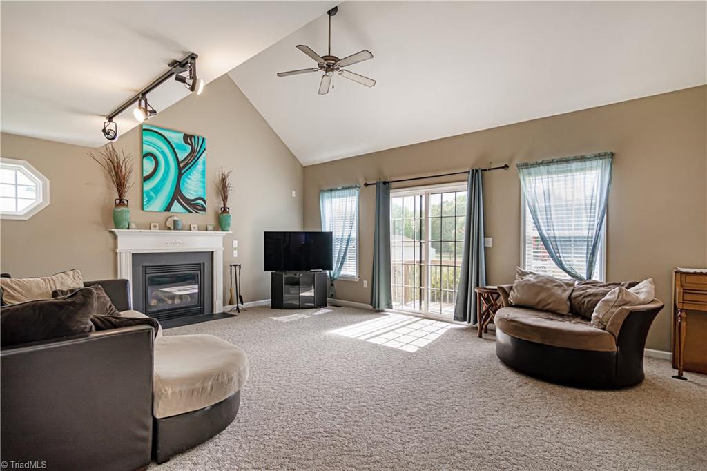 7611 Strawberry Road Summerfield, NC 27358 - Photo 9 of 22 Head through the sliding glass doors to the backyard!