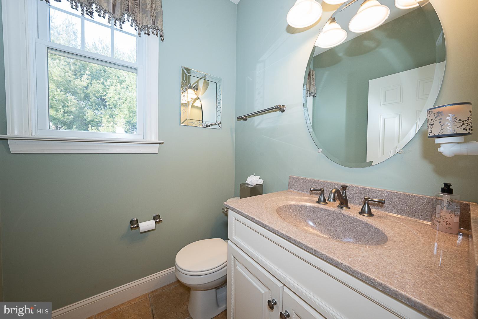 1545 Morstein Road Malvern, PA 19355 - Photo 11 of 41 a bathroom with a granite countertop toilet sink and mirror