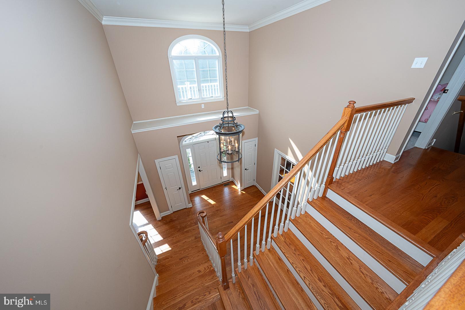 1545 Morstein Road Malvern, PA 19355 - Photo 14 of 41 a view of a livingroom with wooden floor and stairs