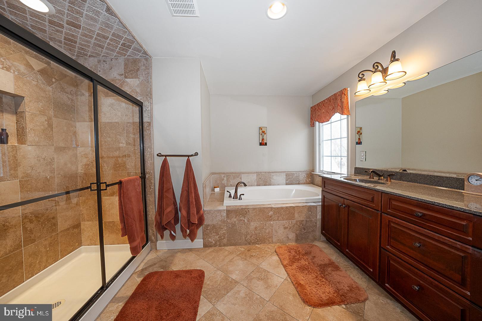 1545 Morstein Road Malvern, PA 19355 - Photo 18 of 41 a spacious bathroom with a tub and a large mirror
