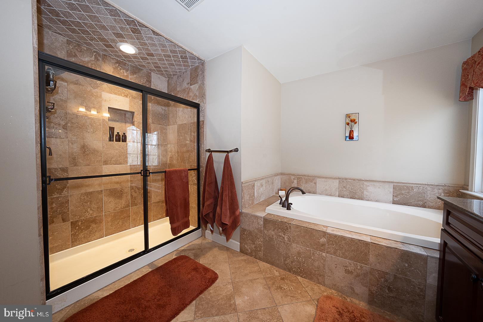 1545 Morstein Road Malvern, PA 19355 - Photo 19 of 41 a bathroom with a bathtub and a shower