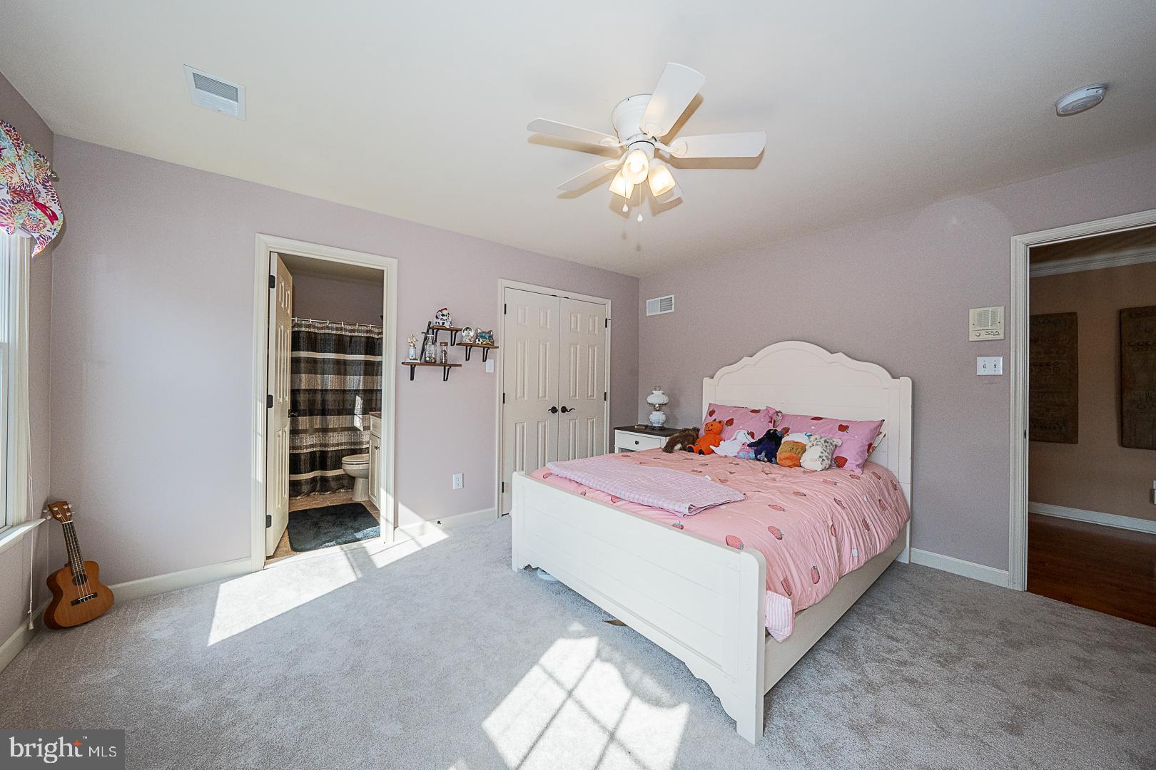 1545 Morstein Road Malvern, PA 19355 - Photo 21 of 41 a bedroom with a bed and a chandelier