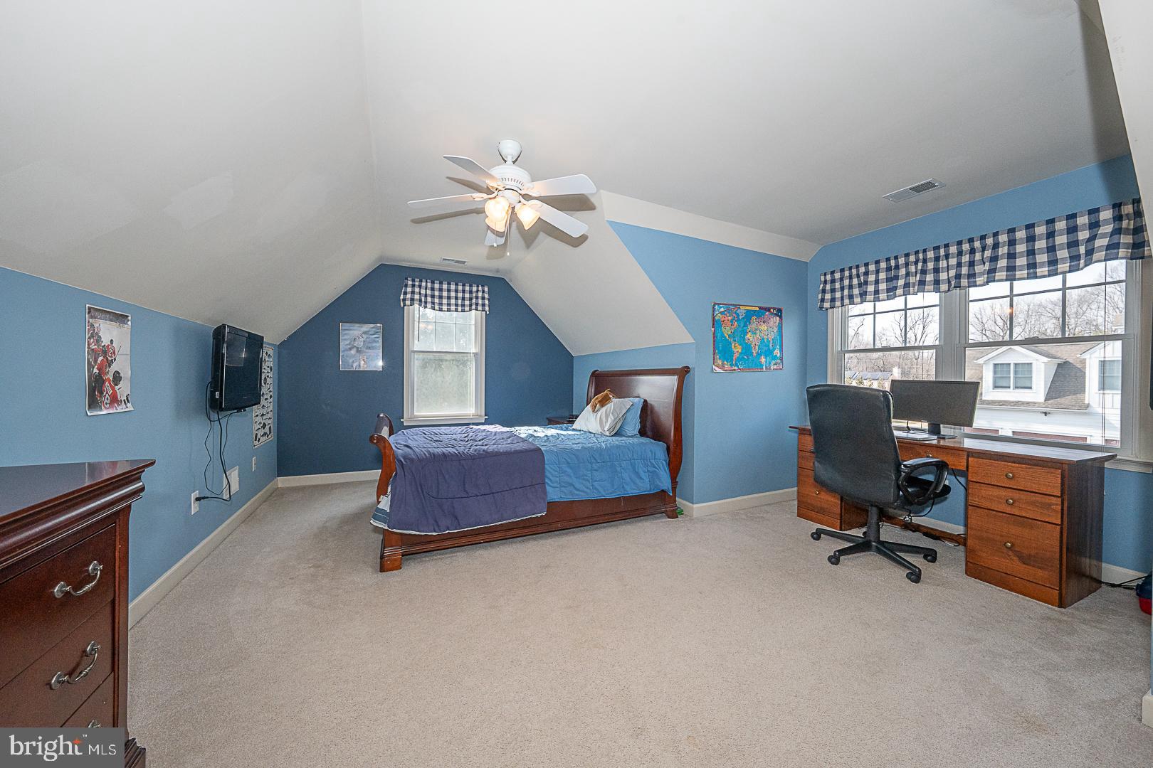 1545 Morstein Road Malvern, PA 19355 - Photo 28 of 41 a bedroom with a bed and a chandelier