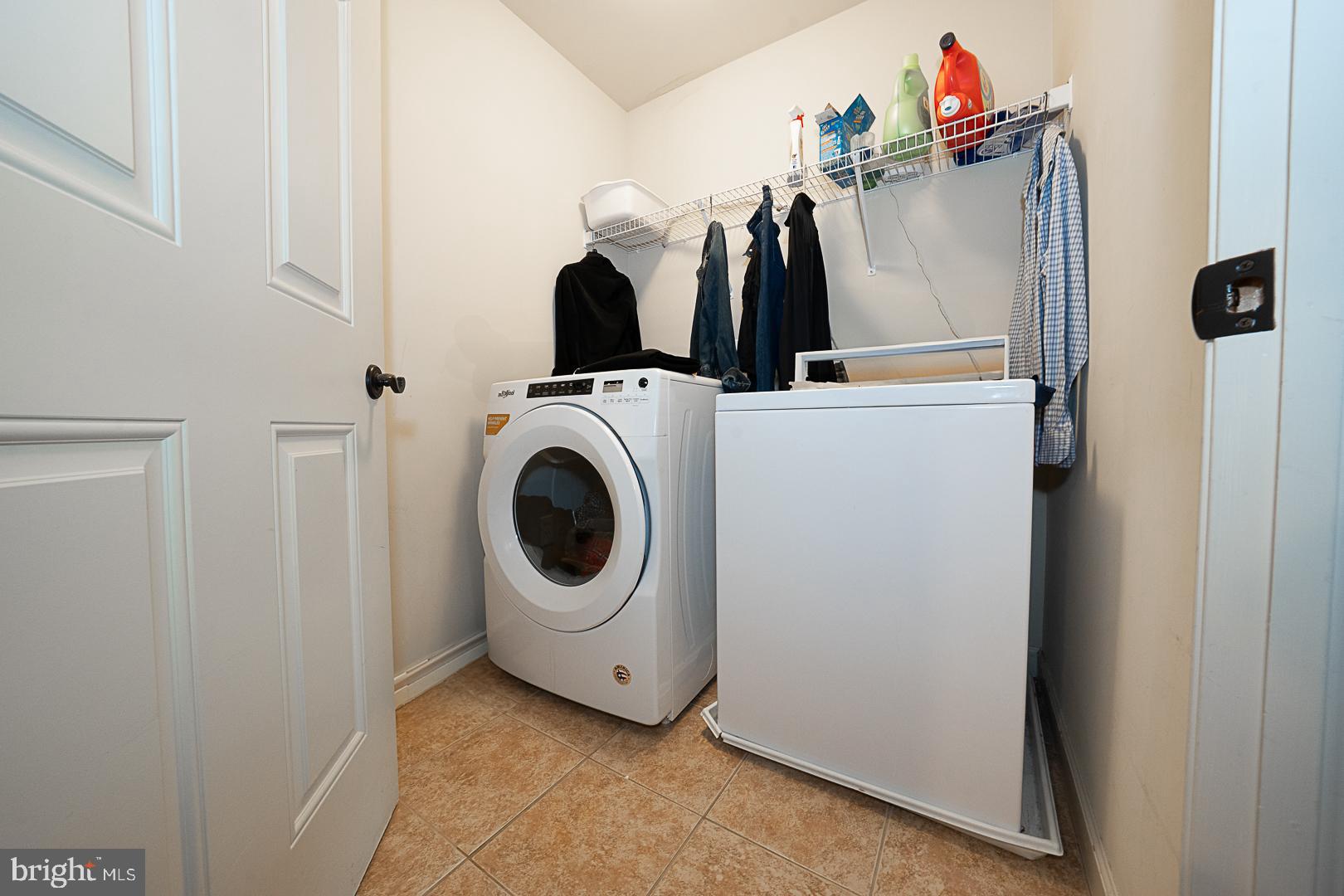 1545 Morstein Road Malvern, PA 19355 - Photo 30 of 41 a view of a storage and utility room with dryer and washer