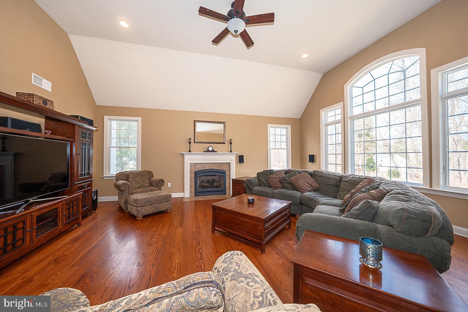 1545 Morstein Road Malvern, PA 19355 - Photo 9 of 41 a living room with furniture fireplace and a flat screen tv