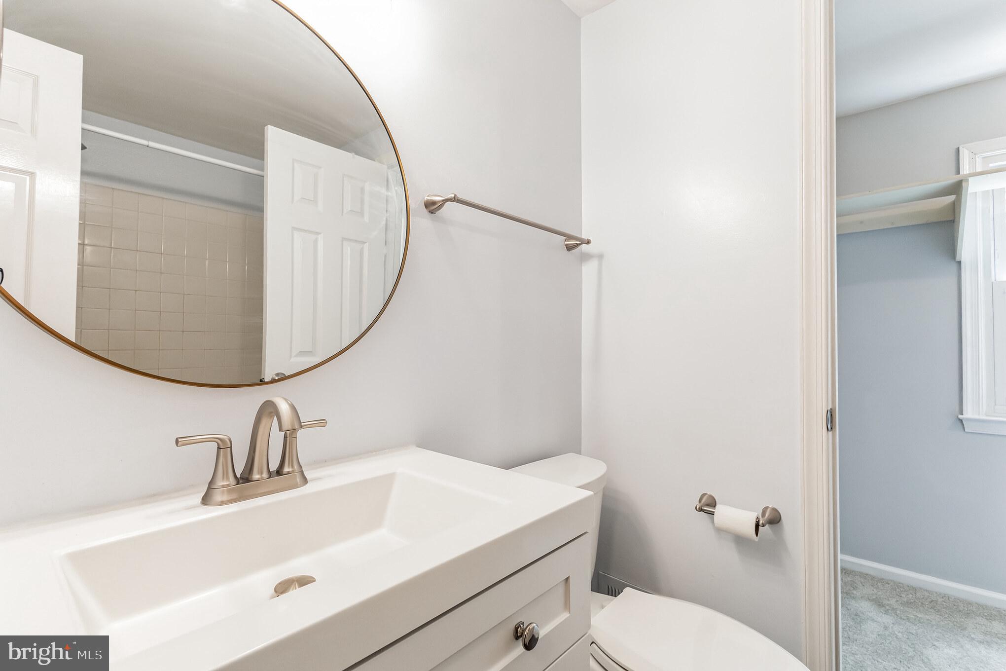 115 Peyton Road Sterling, VA 20165 - Photo 25 of 33 Updated Half Bath w New Vanity, Lighting & Mirror