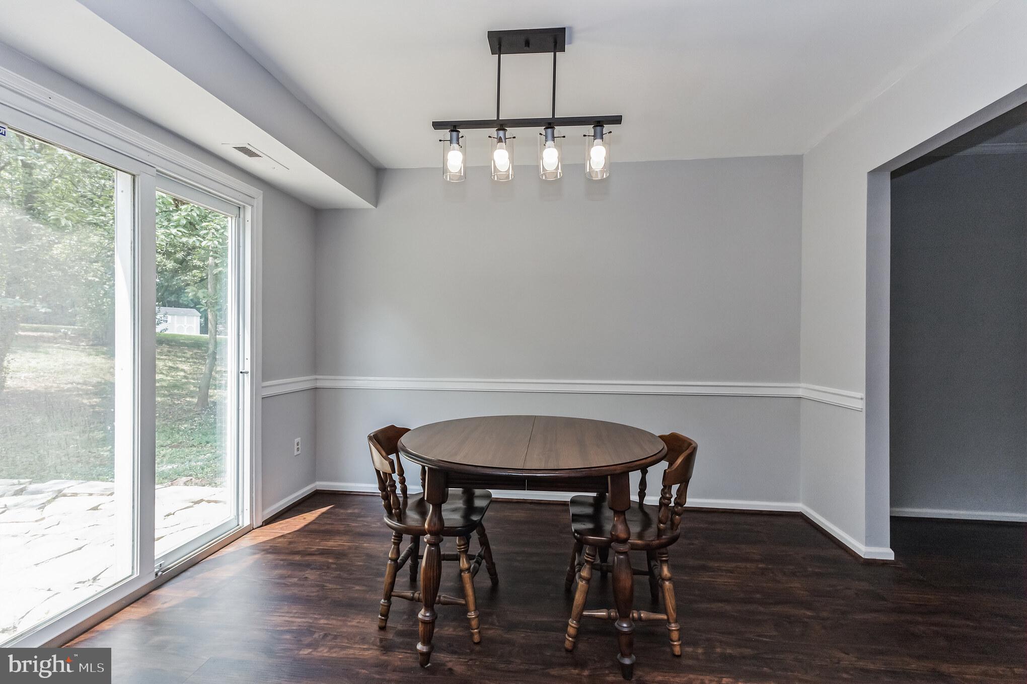 115 Peyton Road Sterling, VA 20165 - Photo 10 of 33 Dining Room with Chair Railing & New Lighting