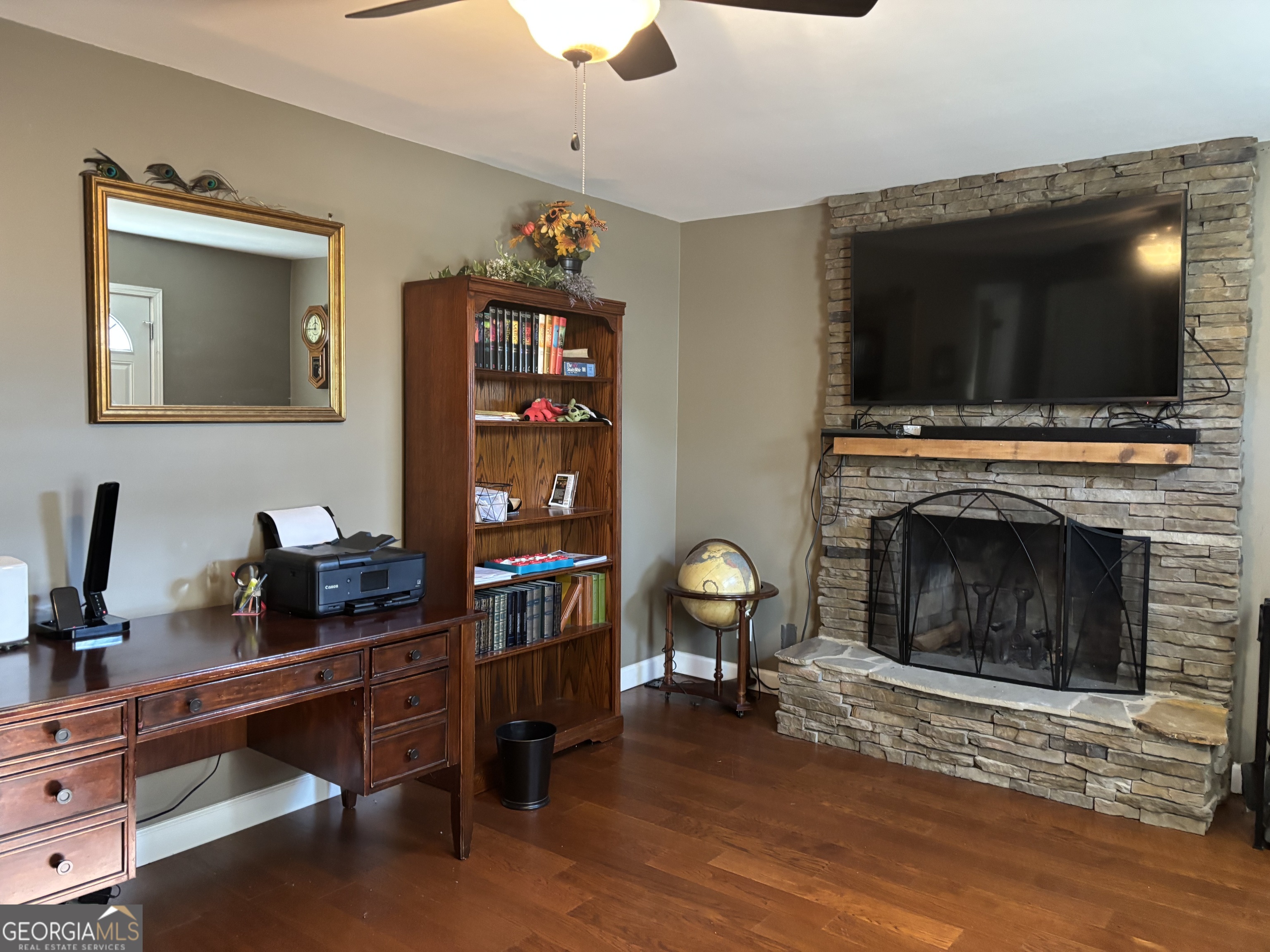 1517 Cave Spring Road Southwest Rome, GA 30161 - Photo 13 of 25 a living room with furniture and a fireplace