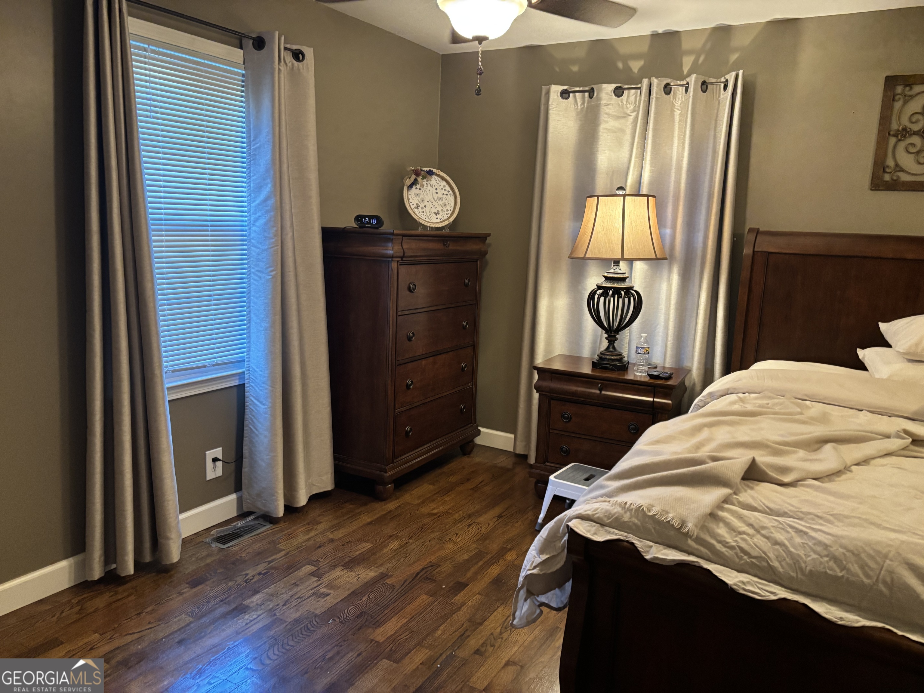 1517 Cave Spring Road Southwest Rome, GA 30161 - Photo 18 of 25 a bedroom with a bed and wooden floor