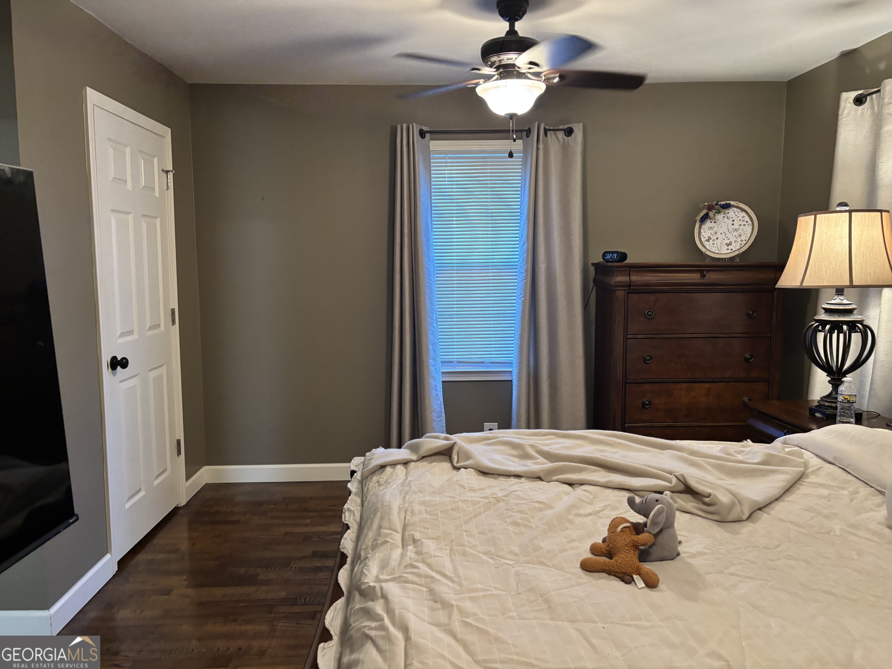 1517 Cave Spring Road Southwest Rome, GA 30161 - Photo 19 of 25 a bedroom with a bed and wooden floor
