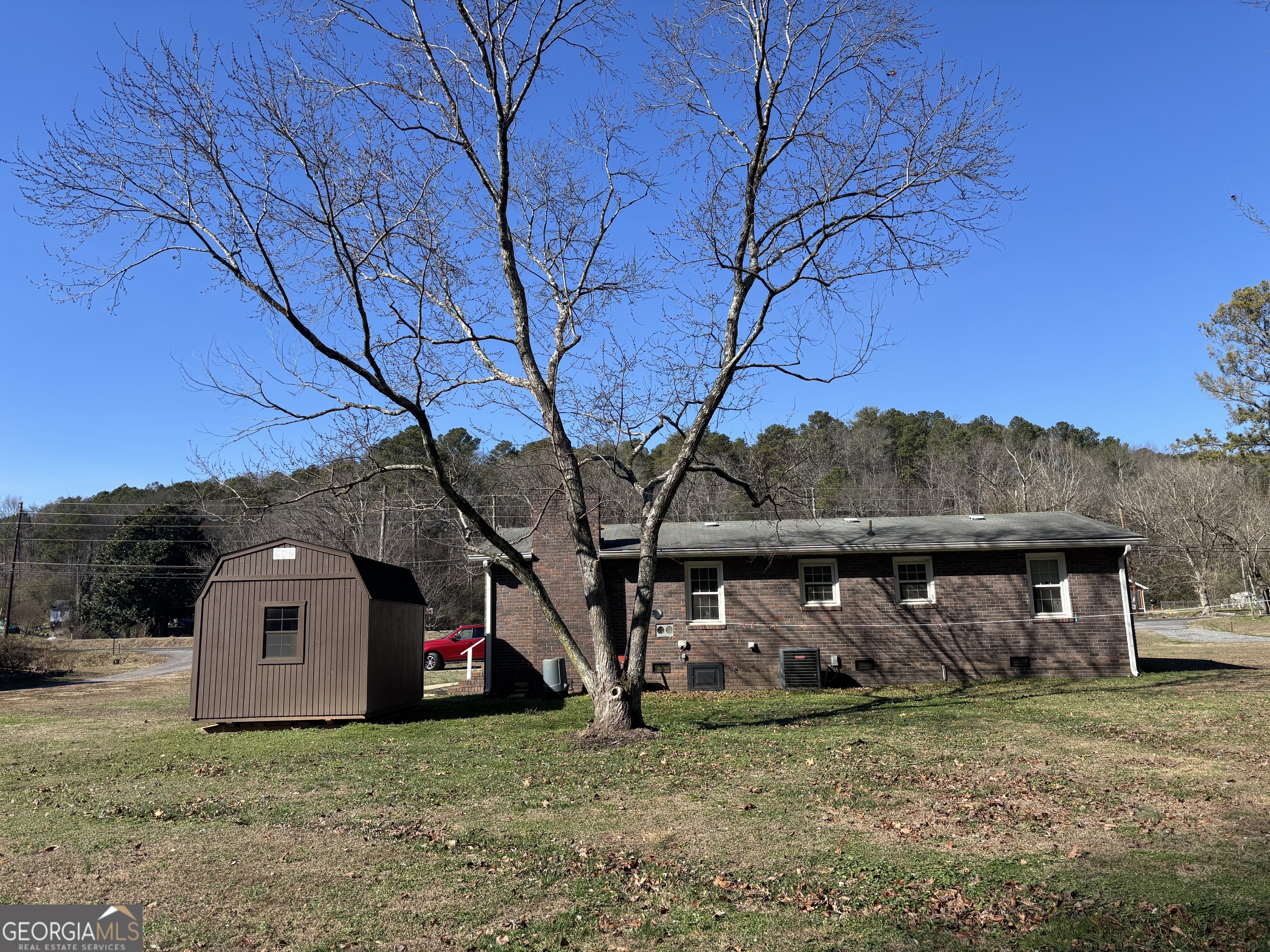 1517 Cave Spring Road Southwest Rome, GA 30161 - Photo 3 of 25 a view of a house with large trees