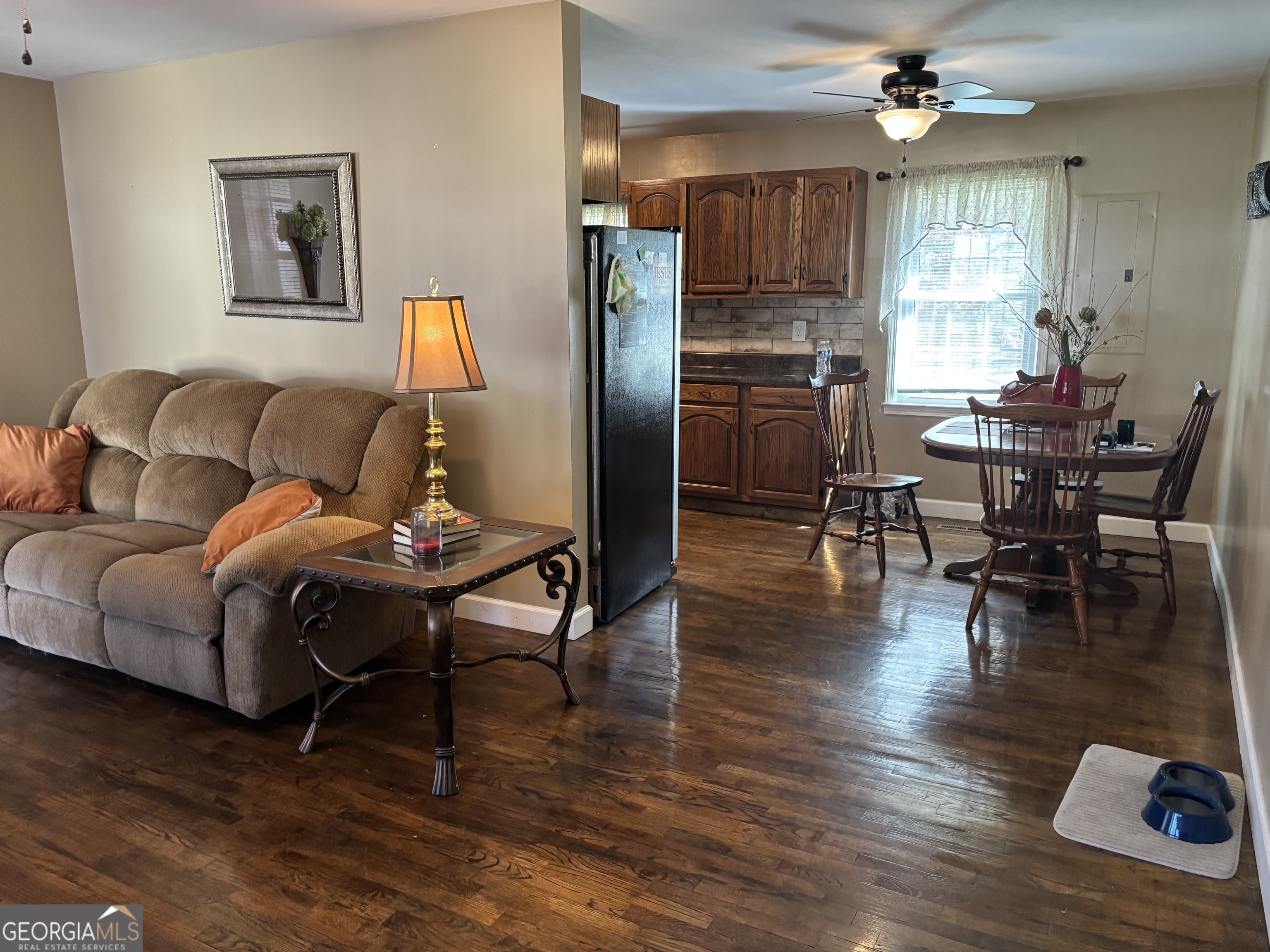 1517 Cave Spring Road Southwest Rome, GA 30161 - Photo 7 of 25 a living room with furniture and a wooden floor