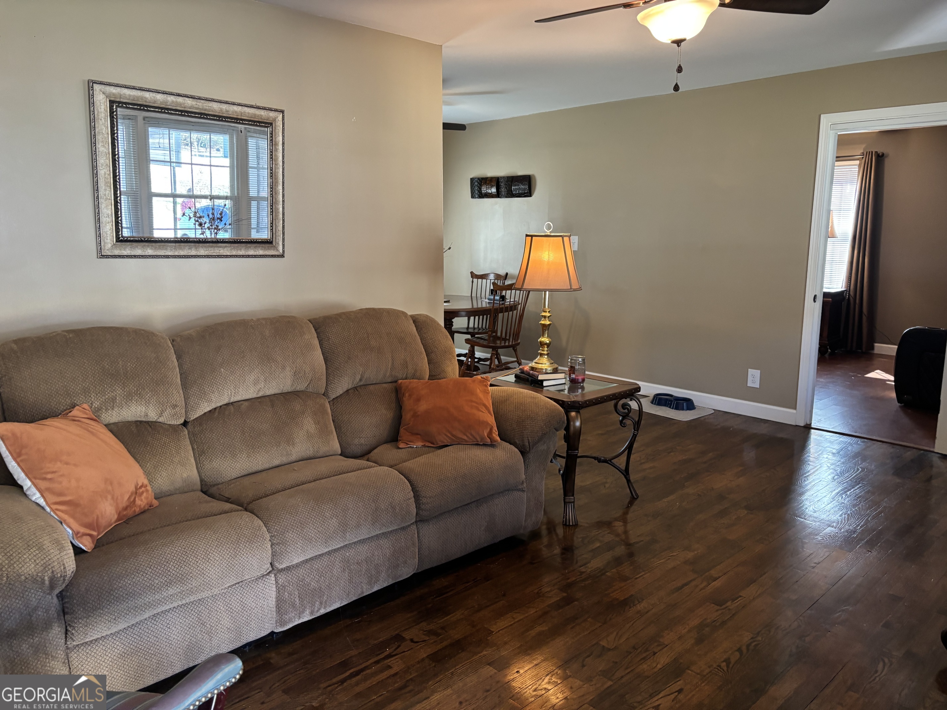 1517 Cave Spring Road Southwest Rome, GA 30161 - Photo 8 of 25 a living room with furniture and a wooden floor