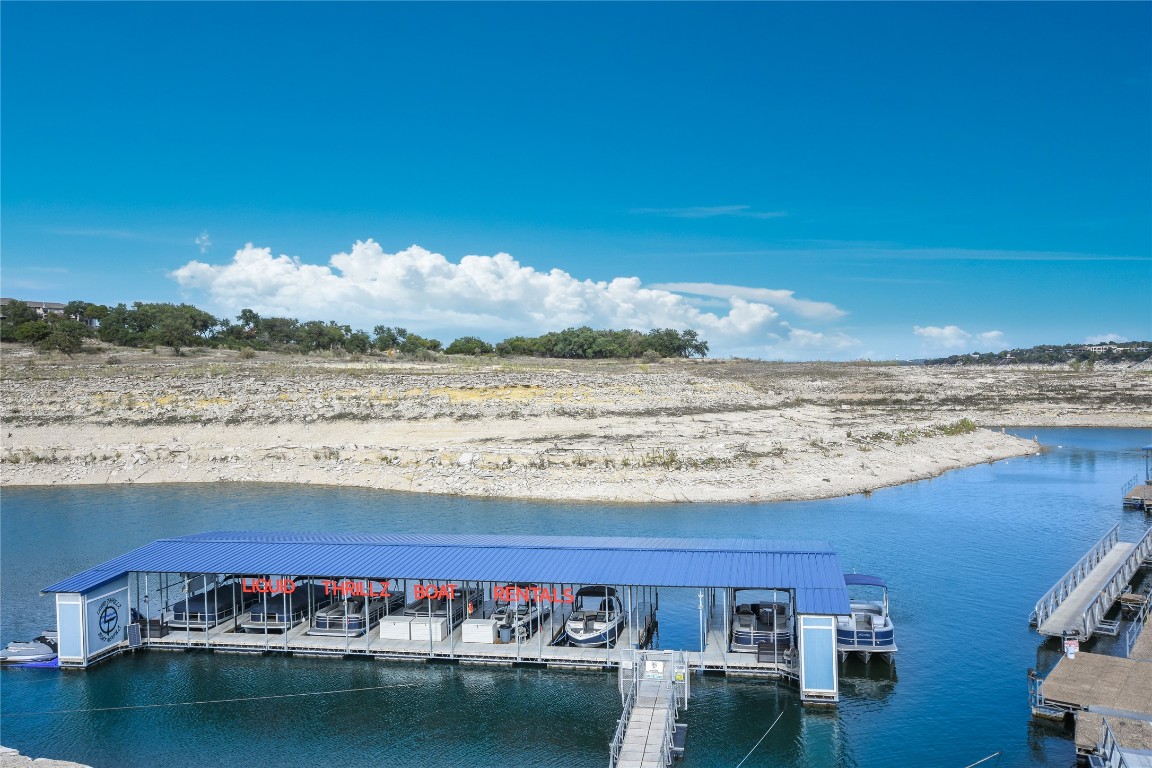 203 Champion Cove Point Venture, TX 78645 - Photo 9 of 10 a view of a lake with furniture