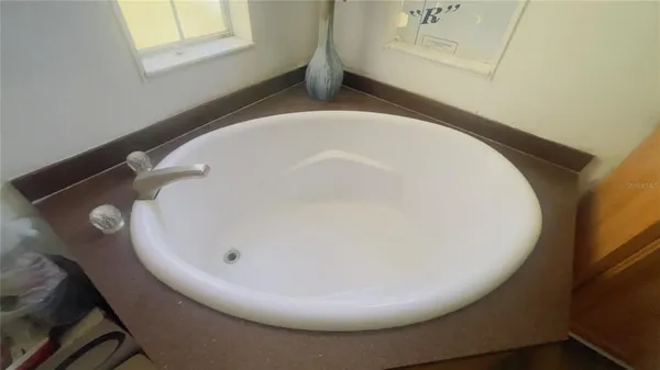 closeup of a sink with wooden floor