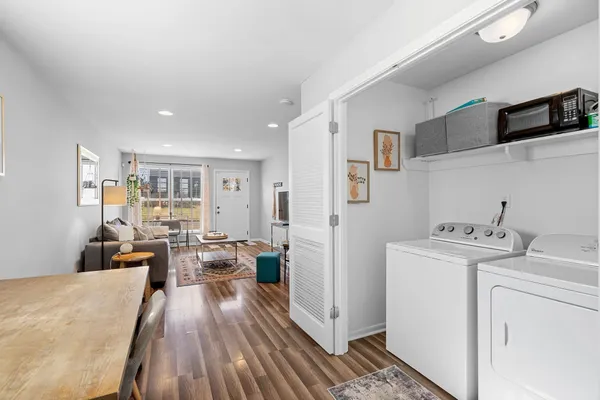 a view of a kitchen with fridge and workspace