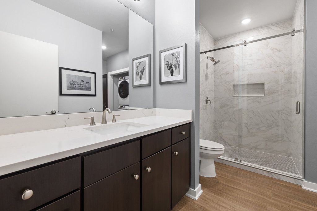 1900 Barton Springs Road, Unit 5009 Austin, TX 78704 - Photo 20 of 35 A well-appointed bathroom features a spacious vanity and a walk-in shower with elegant tile work.