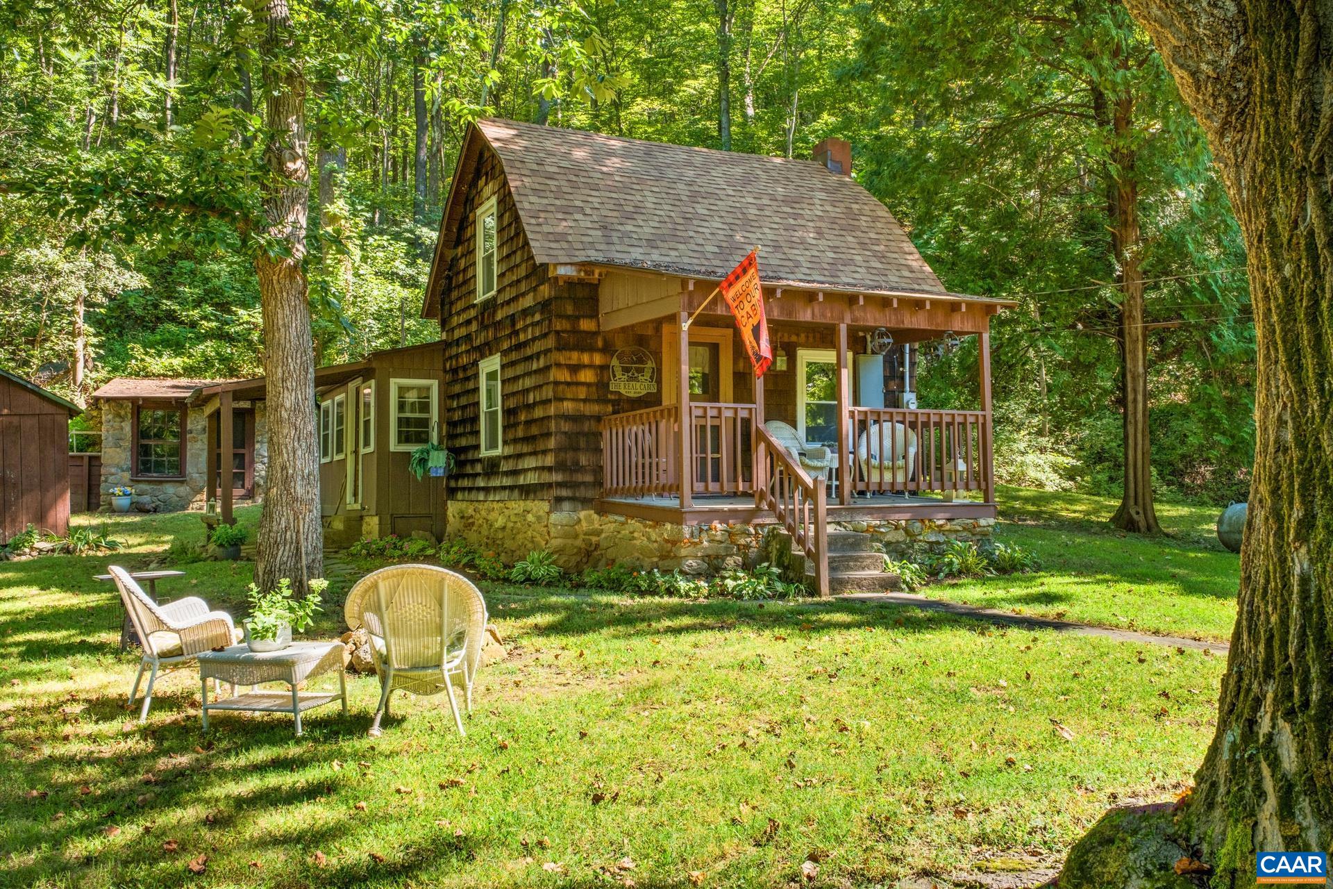 a front view of house with a garden and patio