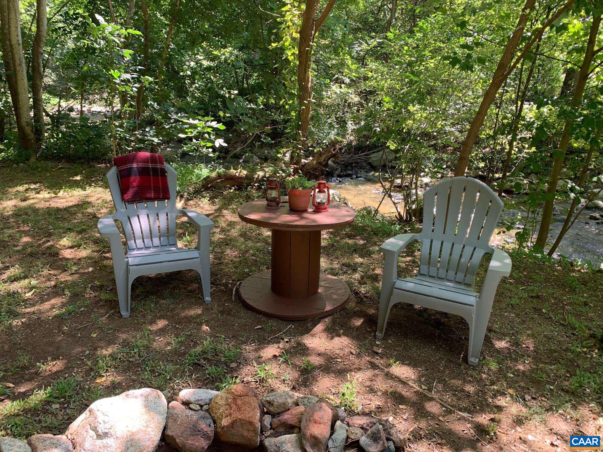 2960 Beech Grove Road Roseland, VA 22967 - Photo 16 of 73 a backyard of a house with table and chairs