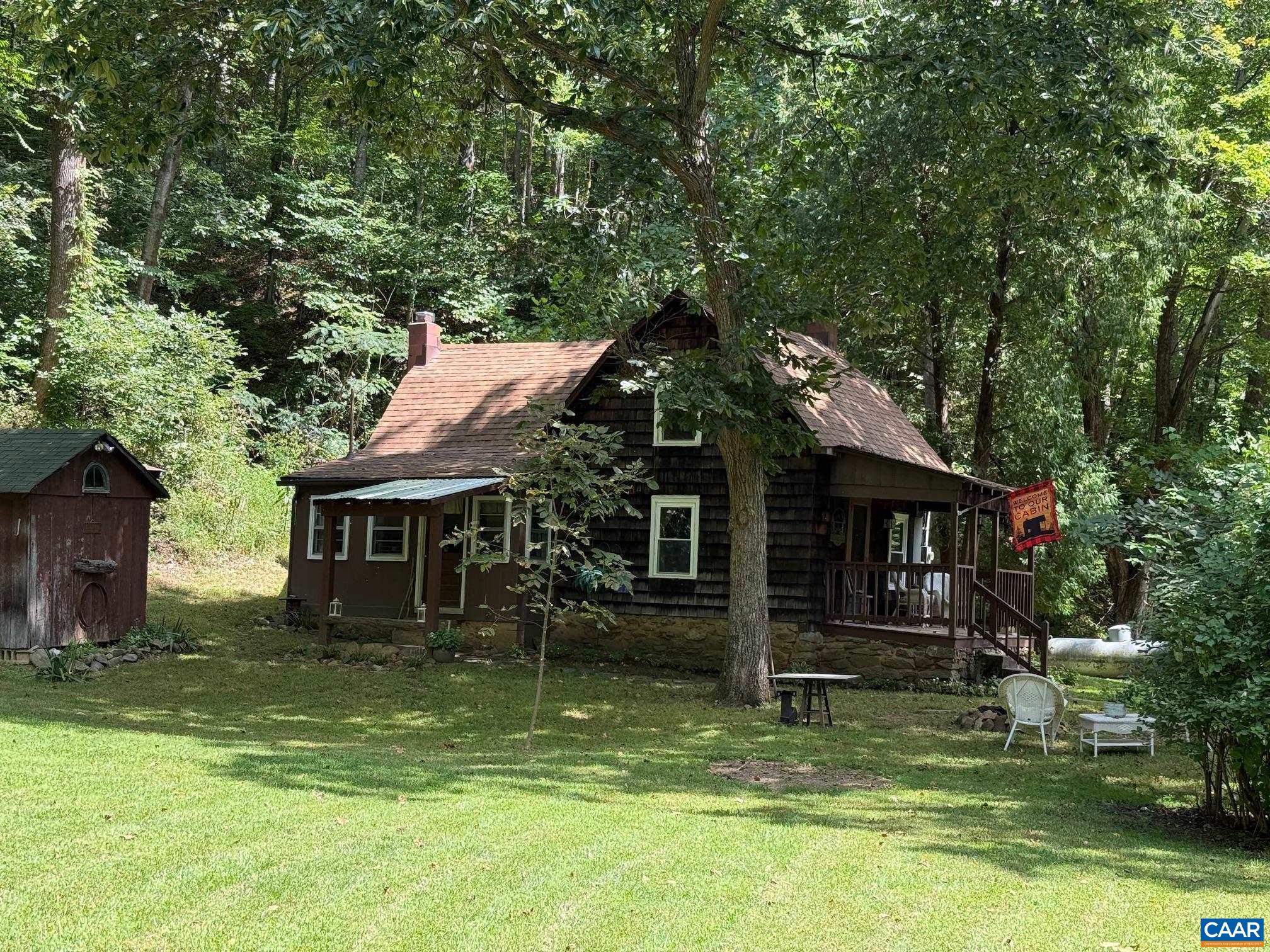 2960 Beech Grove Road Roseland, VA 22967 - Photo 28 of 73 a backyard of a house with yard table and chairs