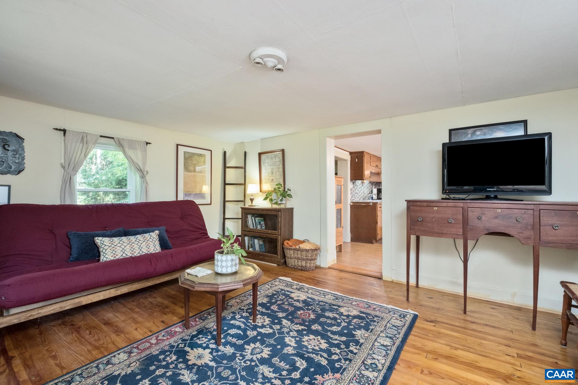 2960 Beech Grove Road Roseland, VA 22967 - Photo 30 of 73 a living room with furniture and a flat screen tv