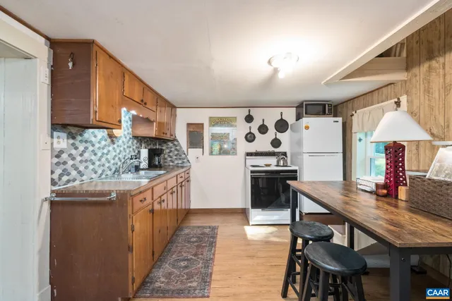 a view of a house with a tree