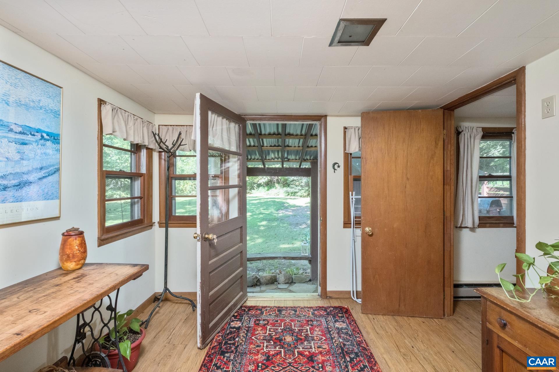 2960 Beech Grove Road Roseland, VA 22967 - Photo 37 of 73 a view of a hallway to a livingroom with furniture