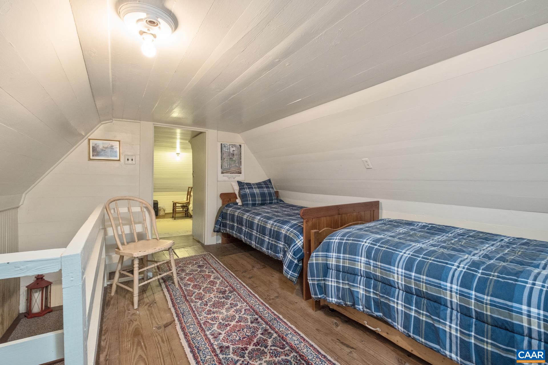 2960 Beech Grove Road Roseland, VA 22967 - Photo 41 of 73 a bedroom with a bed and wooden floor