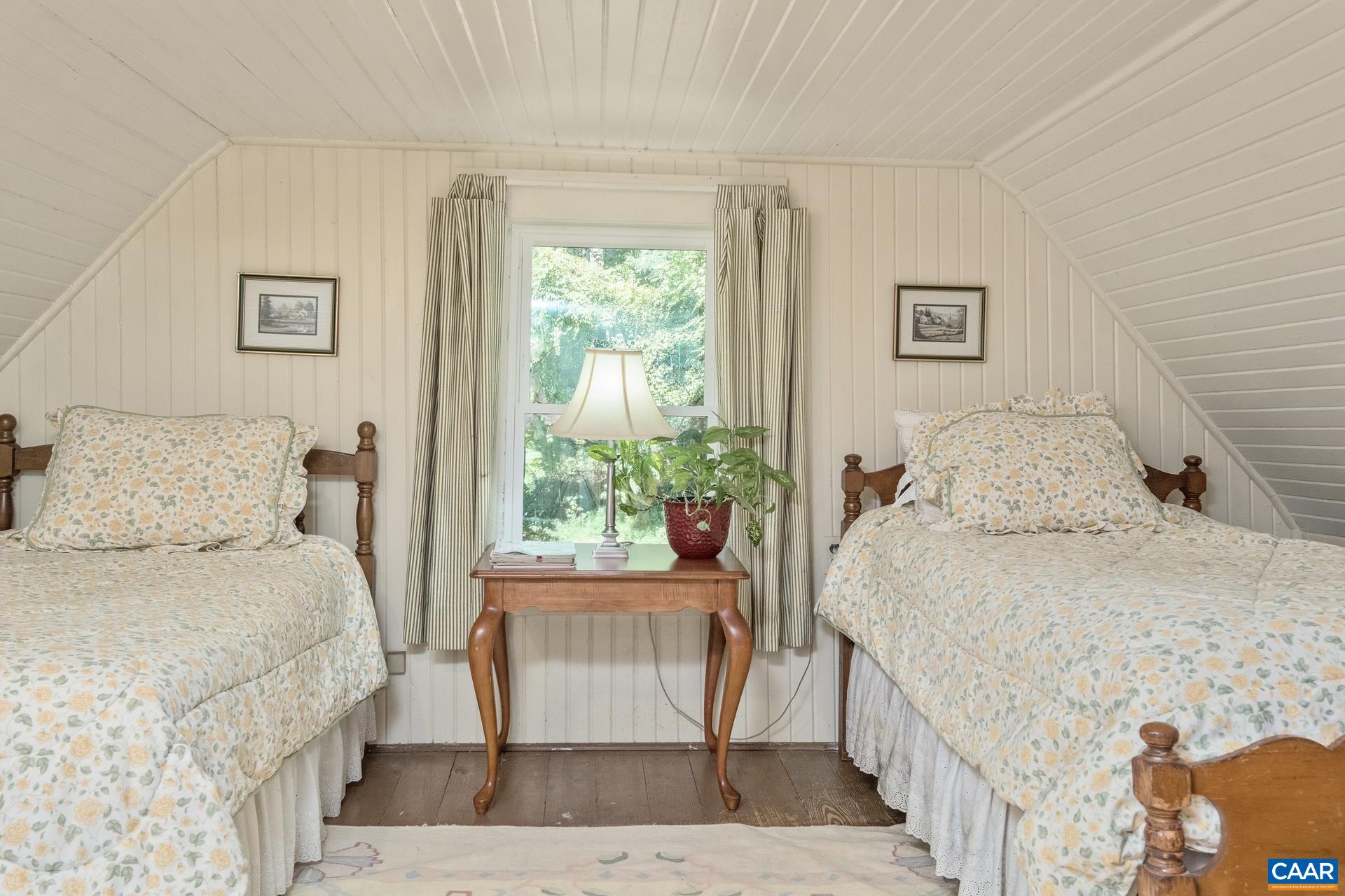 2960 Beech Grove Road Roseland, VA 22967 - Photo 43 of 73 a bedroom with a bed and a table