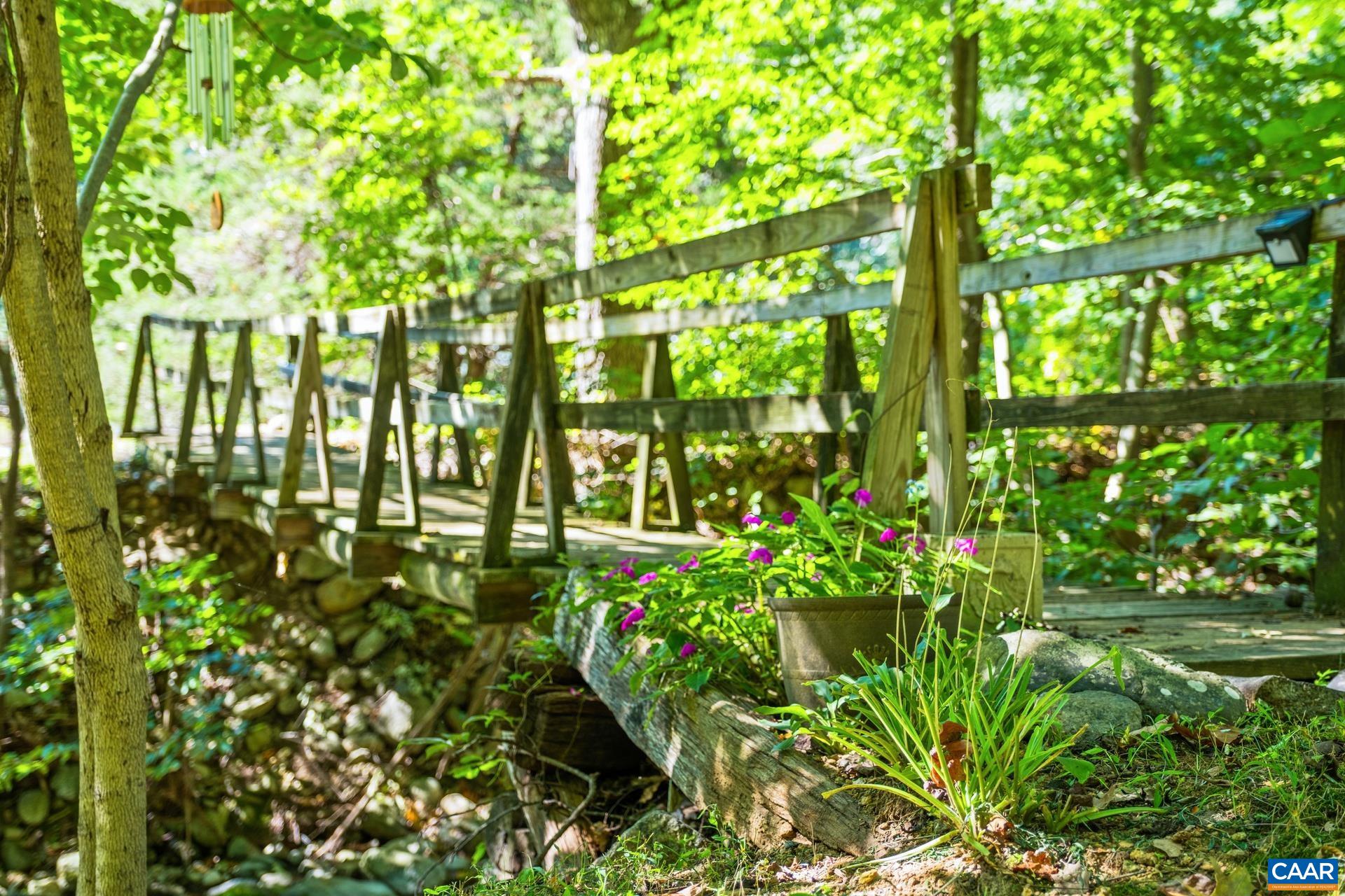 2960 Beech Grove Road Roseland, VA 22967 - Photo 50 of 73 a backyard of a multi story yard with plants and large trees
