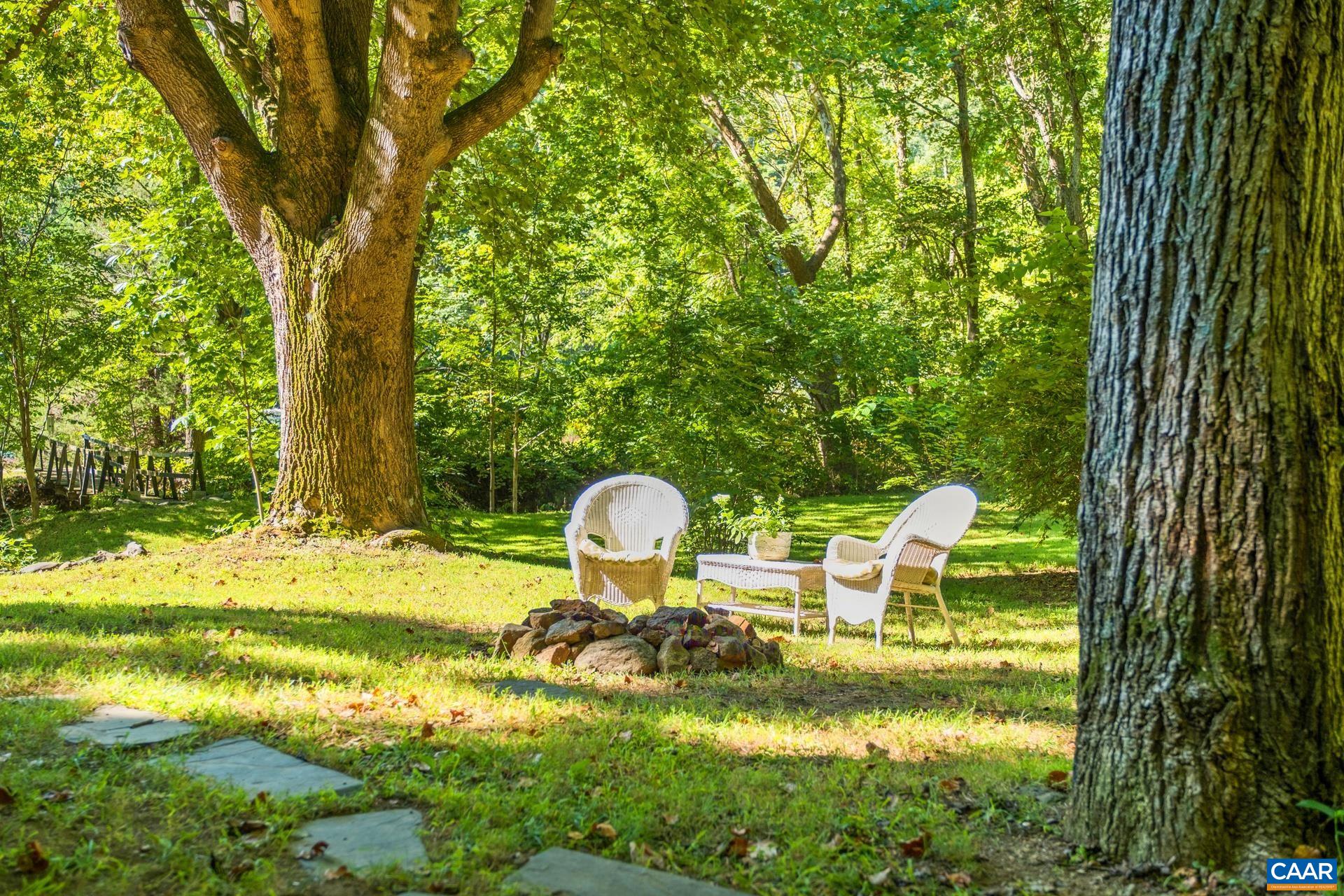 2960 Beech Grove Road Roseland, VA 22967 - Photo 56 of 73 a backyard of a house with yard swimming pool and outdoor seating