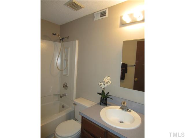 7704 Sandra Lane Raleigh, NC 27615 - Photo 16 of 17 a bathroom with a sink toilet and shower