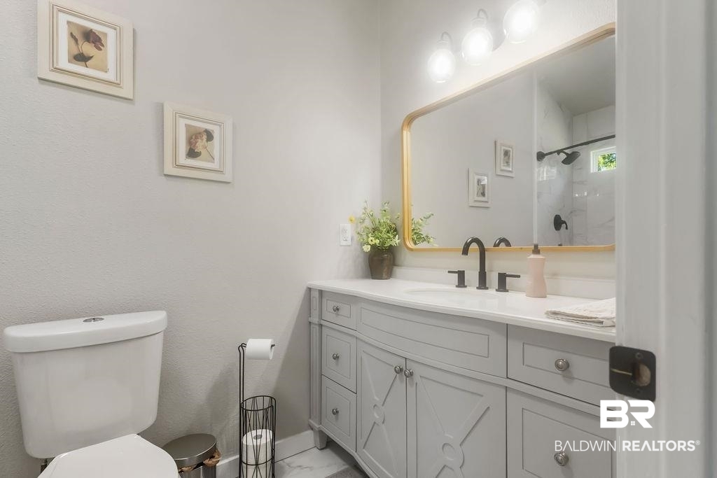 601 East Gate Circle Foley, AL 36535 - Photo 11 of 26 Bathroom with vanity and toilet