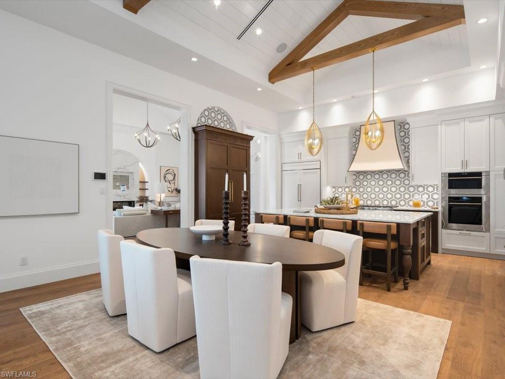 620 Binnacle Drive Naples, FL 34103 - Photo 13 of 49 Dining area with light wood-type flooring, wood ceiling, and high vaulted ceiling
