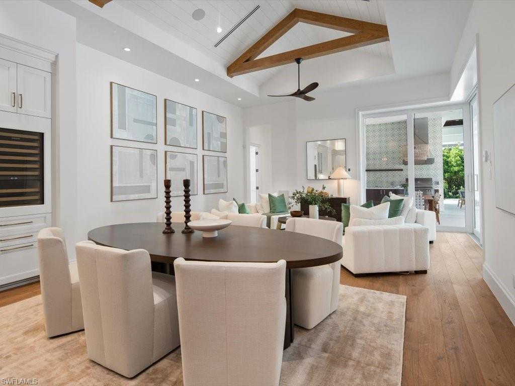 620 Binnacle Drive Naples, FL 34103 - Photo 15 of 49 Dining area featuring high vaulted ceiling, ceiling fan, wood ceiling, and light hardwood / wood-style floors
