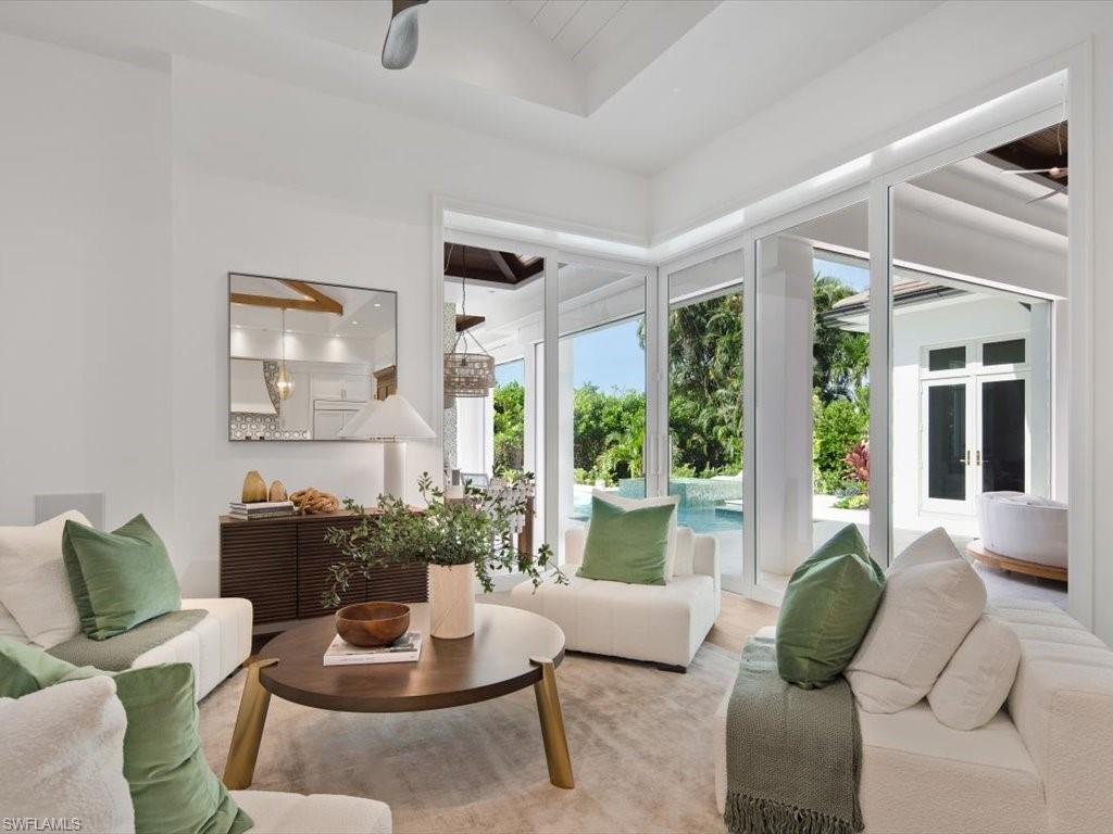 620 Binnacle Drive Naples, FL 34103 - Photo 17 of 49 Sunroom / solarium featuring french doors, lofted ceiling, and a healthy amount of sunlight