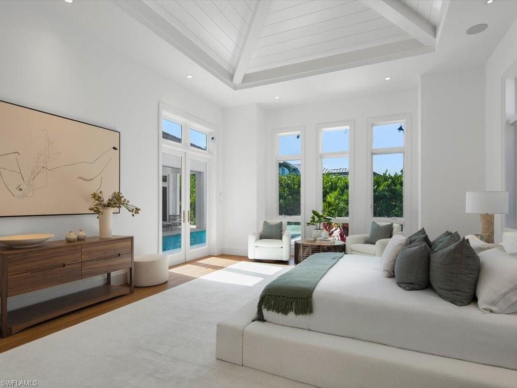 620 Binnacle Drive Naples, FL 34103 - Photo 23 of 49 Bedroom featuring multiple windows, wood-type flooring, and access to outside