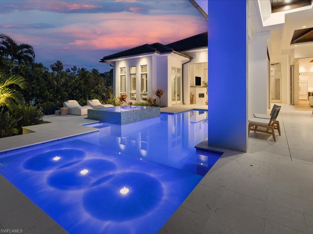 620 Binnacle Drive Naples, FL 34103 - Photo 41 of 49 View of swimming pool with a patio and a hot tub