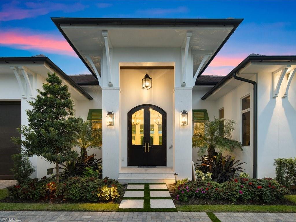 620 Binnacle Drive Naples, FL 34103 - Photo 44 of 49 Exterior entry at dusk with french doors