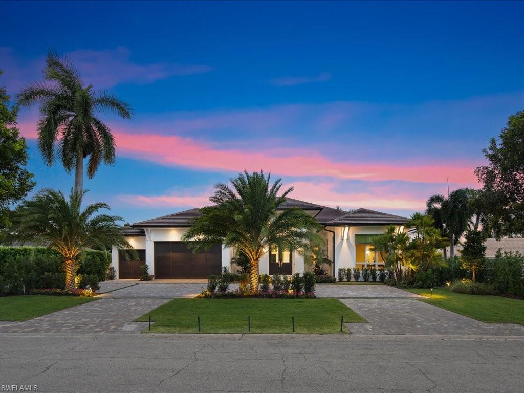 620 Binnacle Drive Naples, FL 34103 - Photo 49 of 49 View of front of home with a yard and a garage