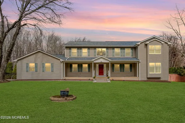 a front view of a house with a yard