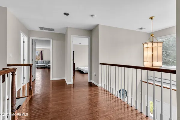 a bedroom with a bed a desk and chair