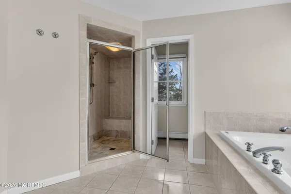 a white bath tub sitting next to a window