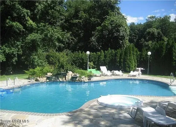 a view of a fountain in a backyard