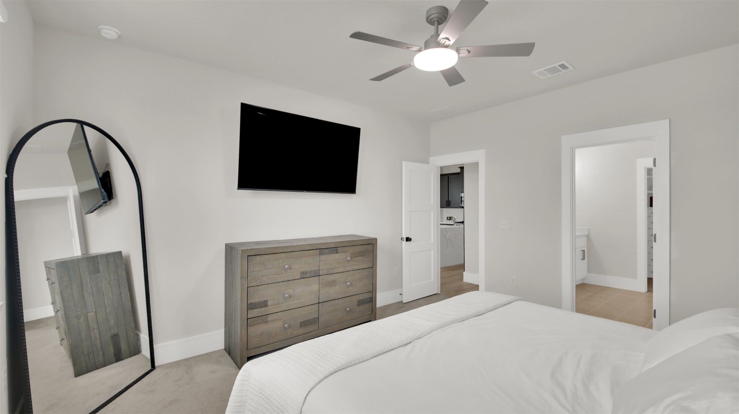 964 Pepperbark Loop Buda, TX 78610 - Photo 10 of 23 Bedroom with ceiling fan and light colored carpet