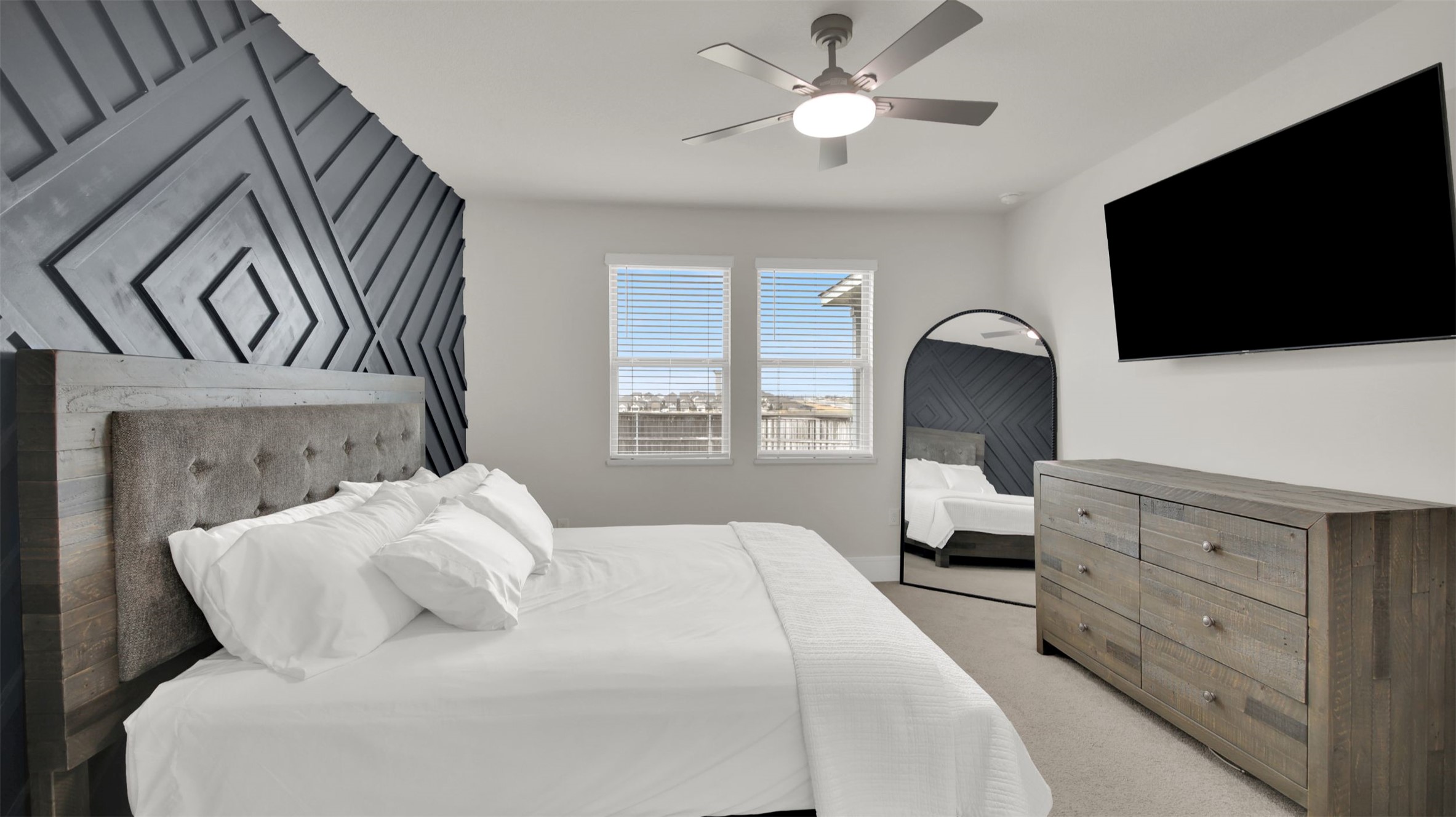 964 Pepperbark Loop Buda, TX 78610 - Photo 11 of 23 Bedroom with light colored carpet and a ceiling fan